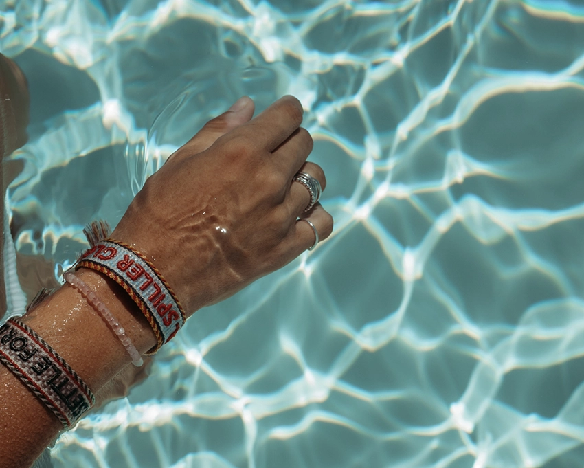 Hand in the water with Dr. Spiller bracelet