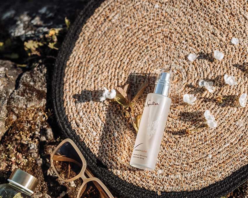 SUMMER GLOW Maximum Moisture Hyaluronic Spray placed decoratively