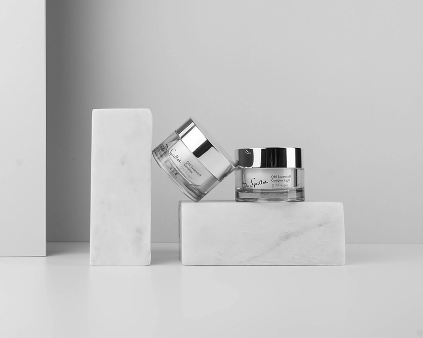 Two Dr. Spiller face care jars placed decoratively