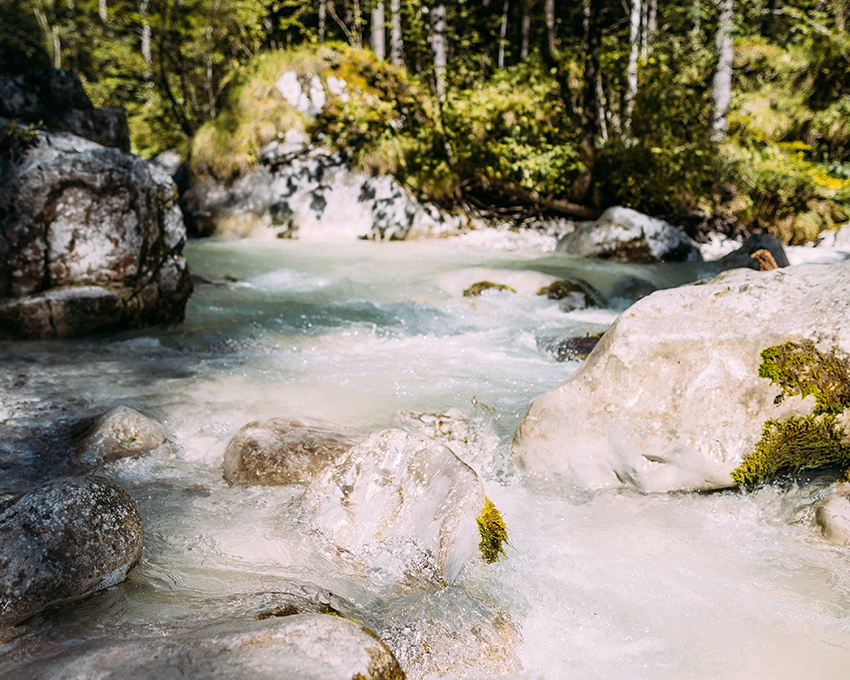 Flowing water in a mountain stream in nature