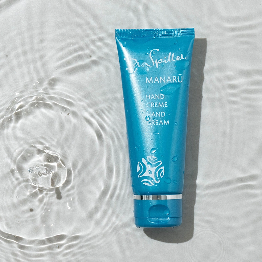 MANARU hand cream lies in clear water